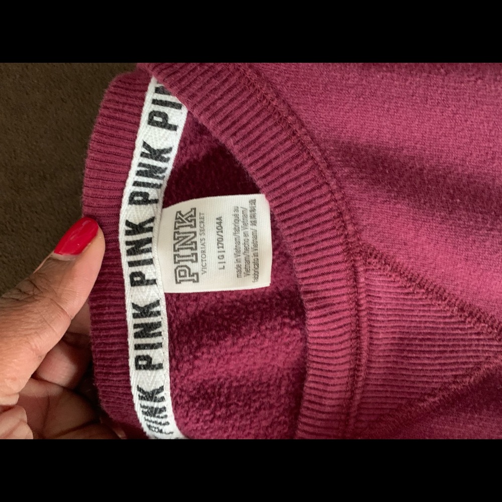 Size Med pants and Large Shirt..Color is burgundy